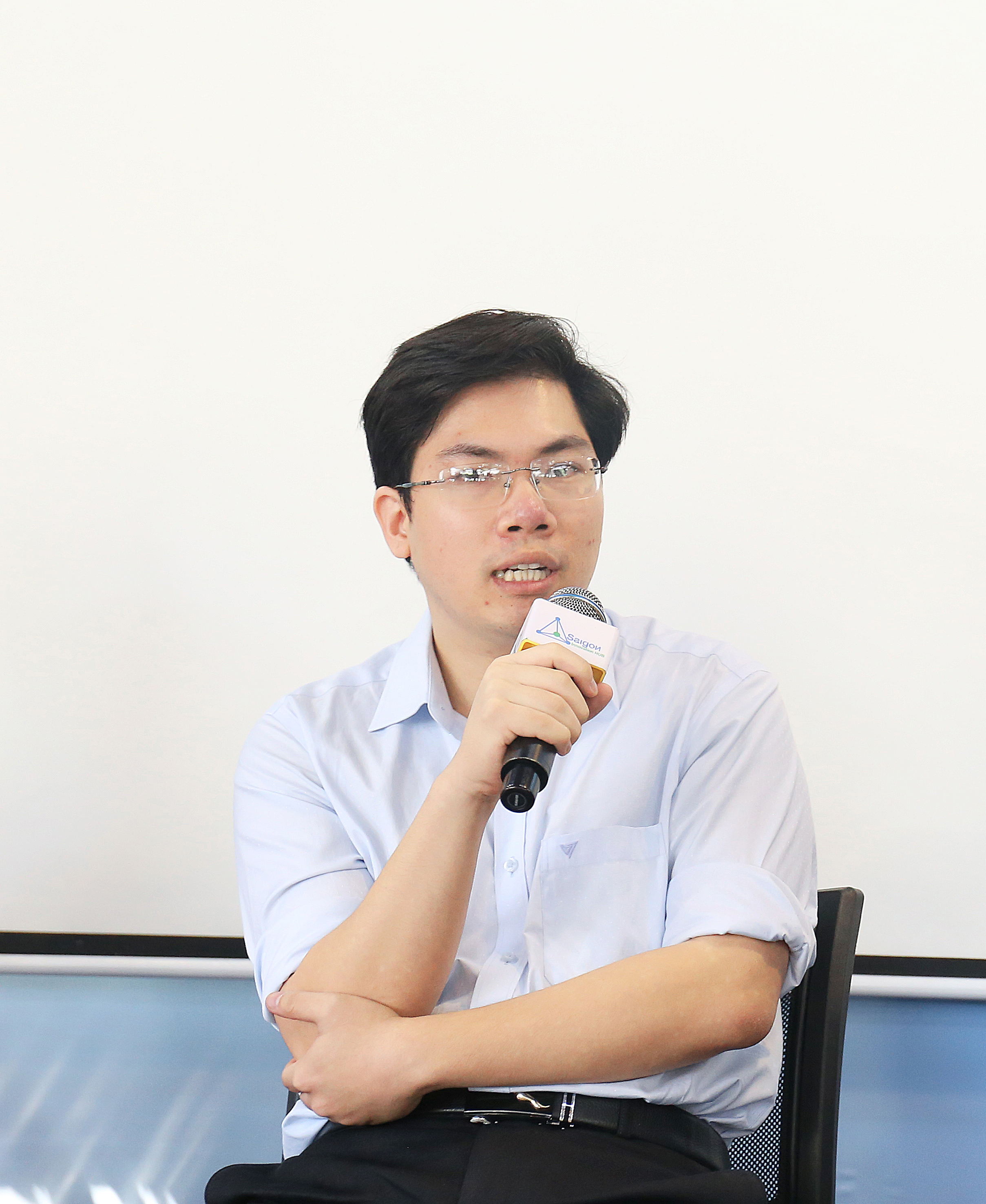 Anh Phạm Nam Long trong một hội thảo do Báo KH&PT/Ấn phẩm Tia Sáng tổ chức. 